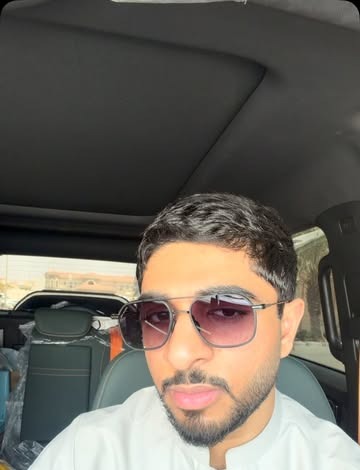 Man wearing Just Believe Chairmen black aviator sunglasses